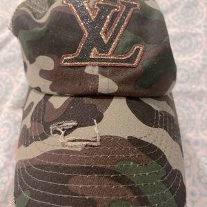 Distressed trendy L V hat. Super cute!